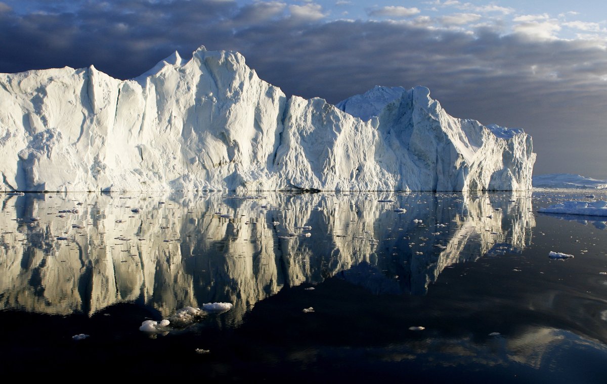 icebergs-are-reflected-in-the-calm-waters-at-the-mouth-of-the-jakobshavn-ice-fjord-on-the-west-coast-of-greenland