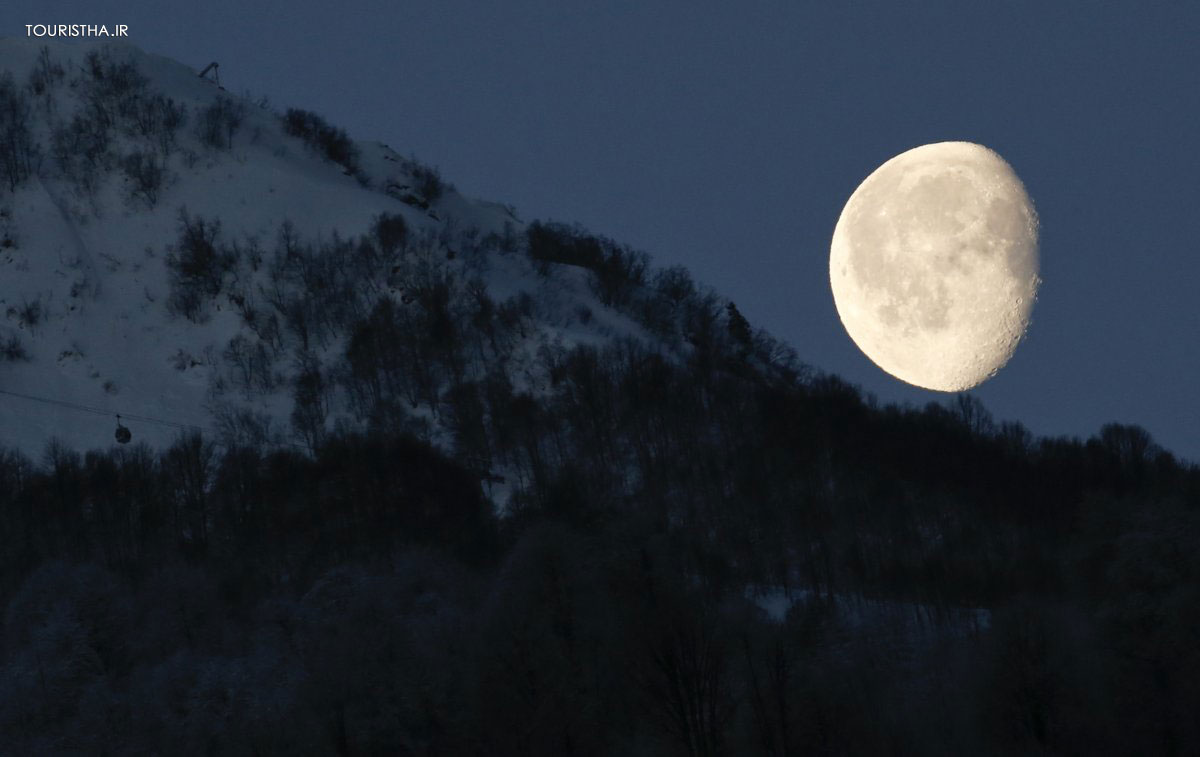 the-moon-is-pictured-above-the-mountains-in-rosa-khutor-in-russia-during-the-2014-sochi-olympics